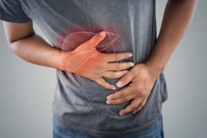 large intestine is on the man's body against gray background - Pancreatitis