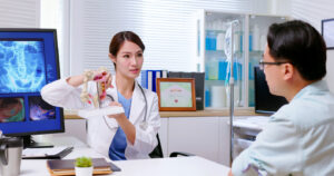 Doctor explain colon mode to patient