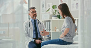 gastroenterologists consulting lady patient for digestive health issues